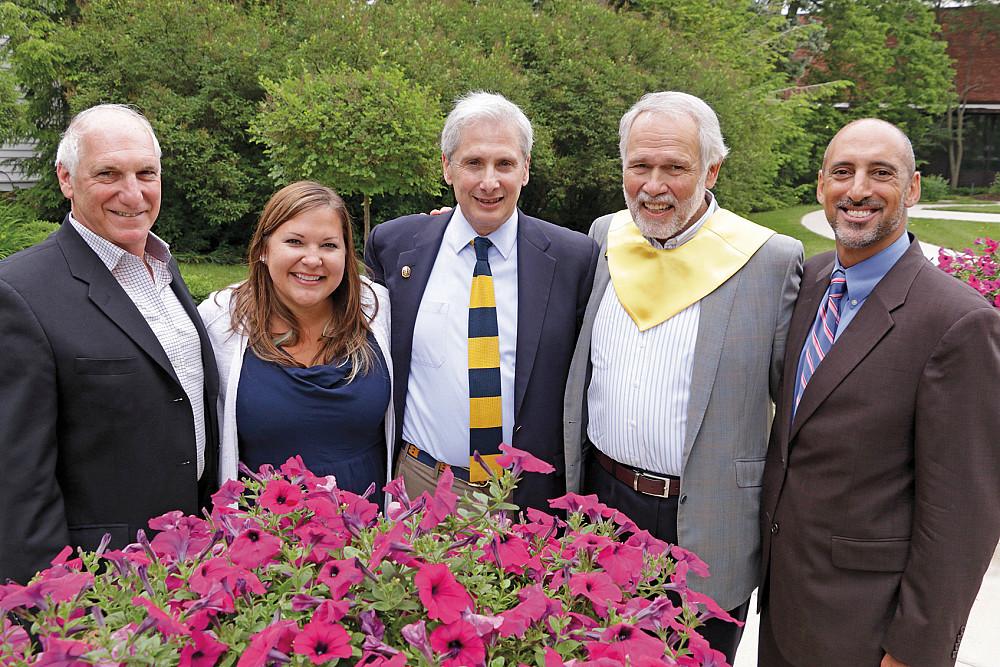 Distinguished Service Citation and Young Alumni Award recipients join President Scott Bierman dur...