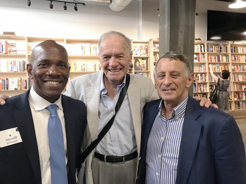 Steven Hawkins (right), Beloit's 2017 - 18 Weissberg Chair, poses with Pulitzer Prize-winning international journalist Roy Gutman (left),...